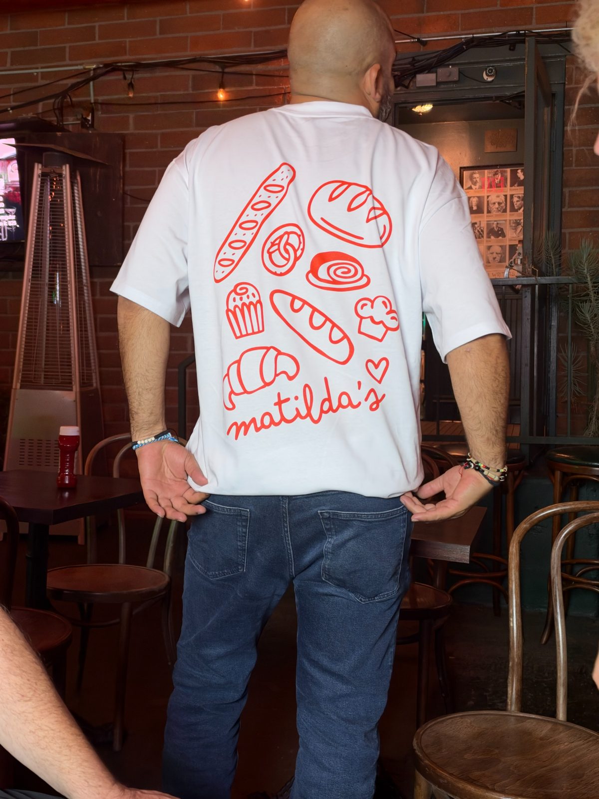 The tee worn, back